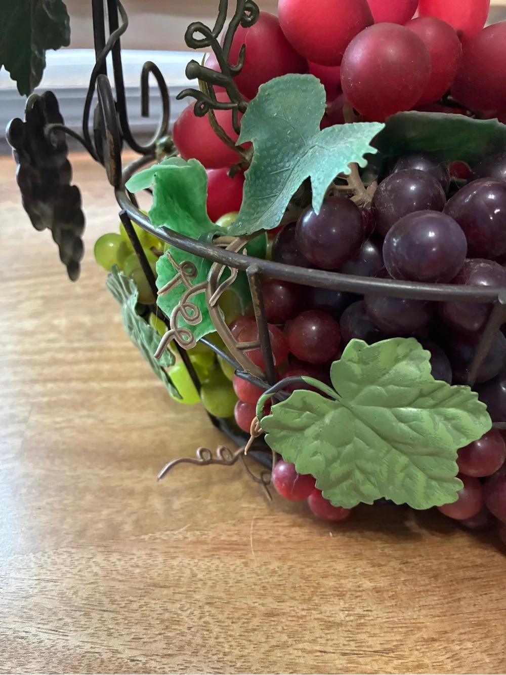 decorative artificial grape clusters, in a wire basket 8” x 10”